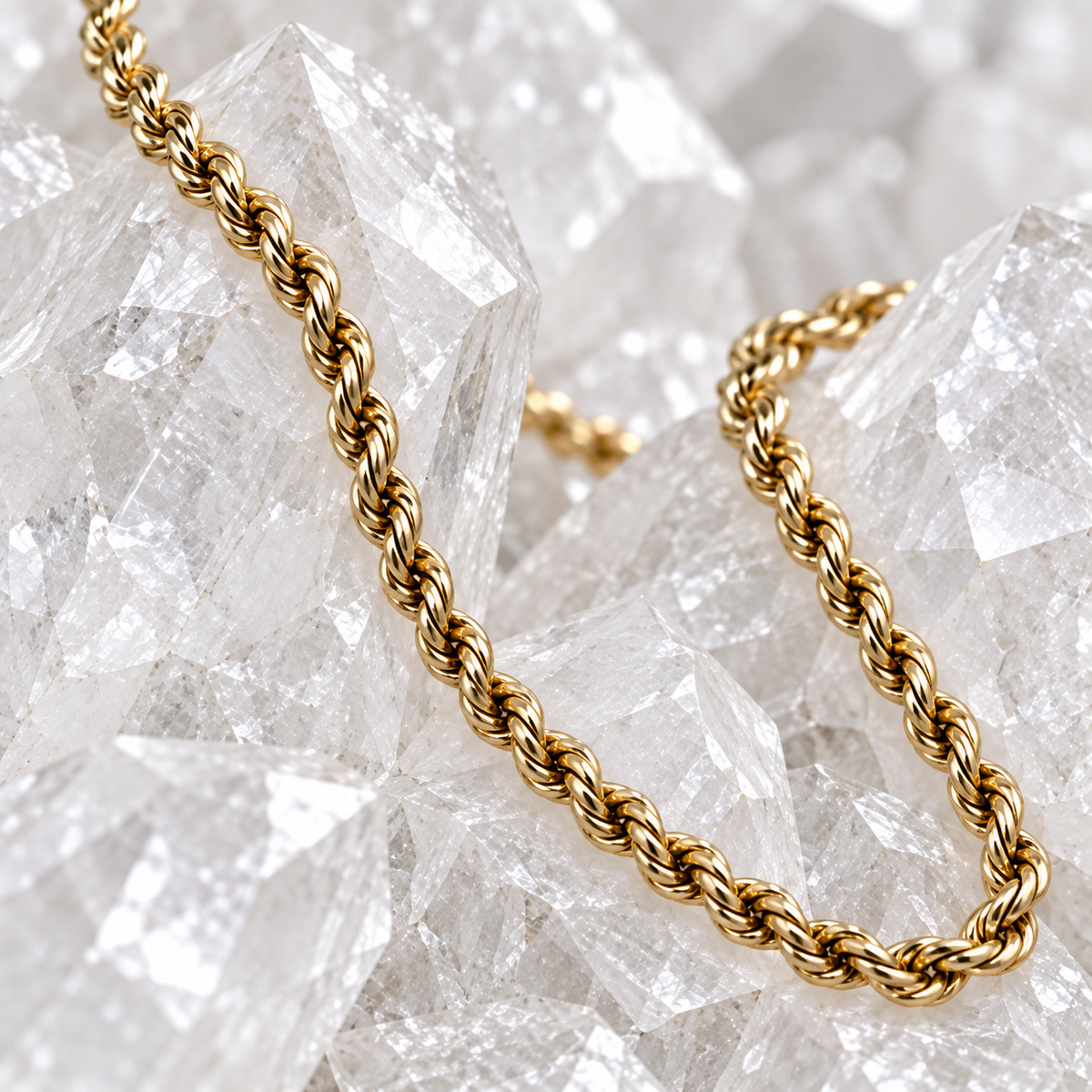 Close-up of the diamond-cut texture on a solid 14K yellow gold rope chain