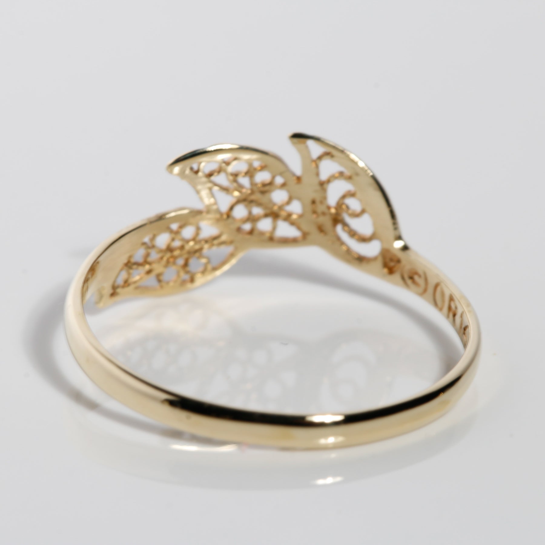 Back view of lightweight 14K solid yellow gold leaf ring band