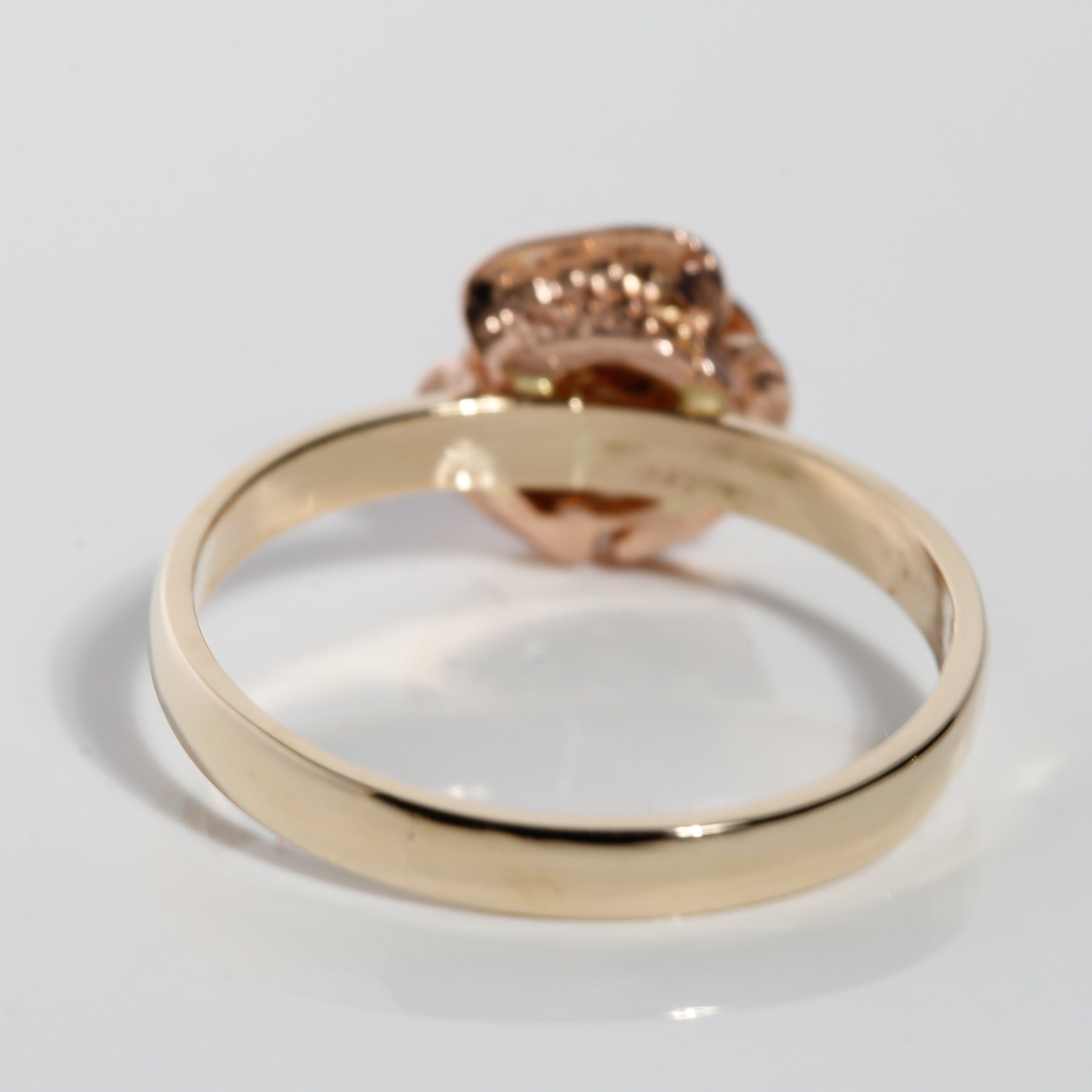 Back view of 14K solid gold band with sculpted rose flower design