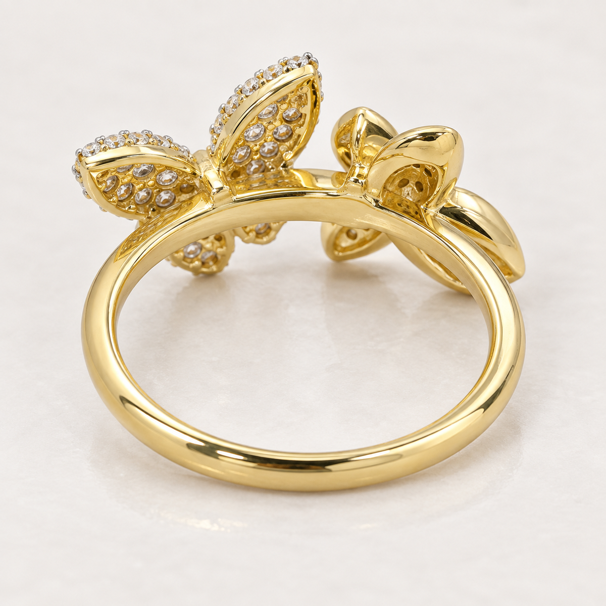     Back view showing the yellow gold band and construction of a 14K butterfly bypass ring.