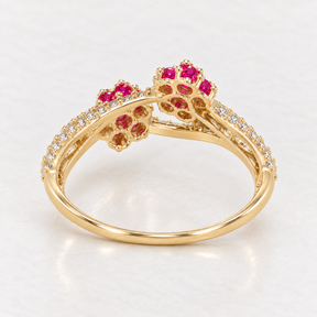 Back view showing the polished gold band and open flower settings of a 14K solid gold bypass ring