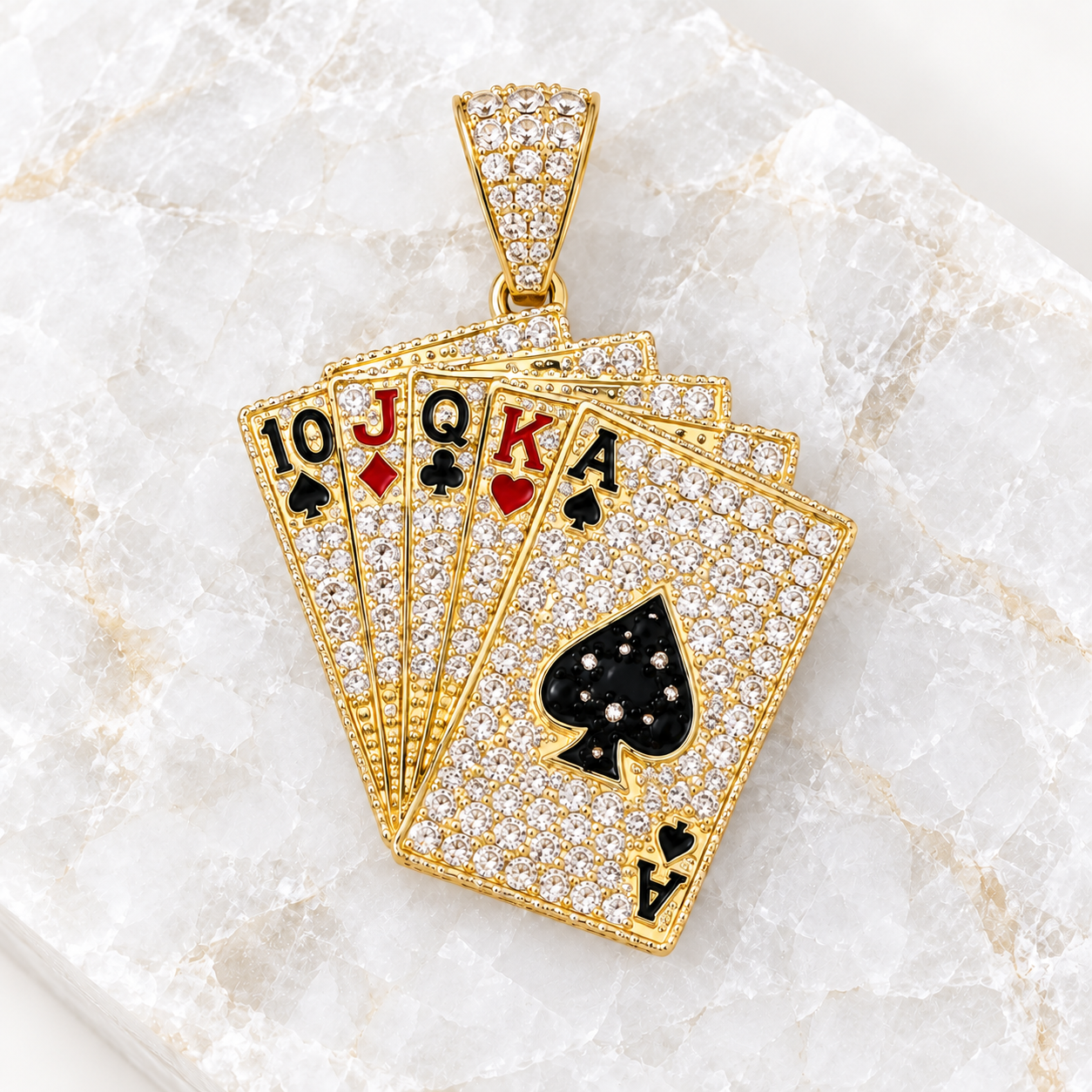 14K solid gold playing cards cubic zirconia pendant displayed on a light natural crystal tile