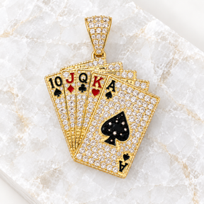 14K solid gold playing cards cubic zirconia pendant displayed on a light natural crystal tile