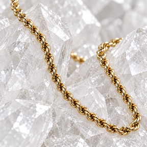 Close-up of the diamond-cut texture on a solid 14K yellow gold rope chain