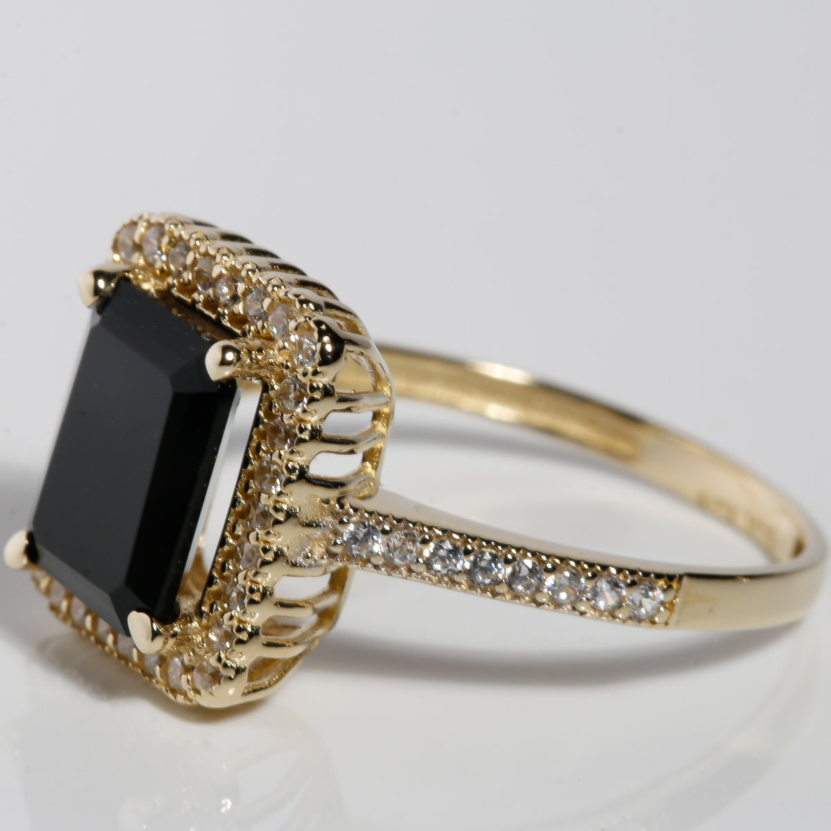 Side view of 14K solid gold black onyx ring with cubic zirconia halo setting