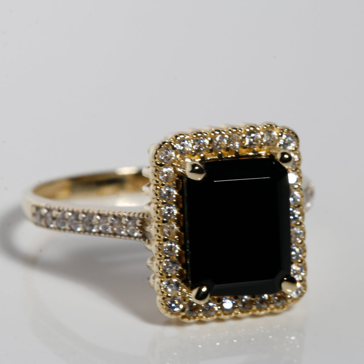 14K solid yellow gold ring with black onyx center stone and cubic zirconia halo