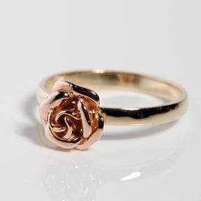 Side view of 14K solid yellow gold band with rose gold flower ring